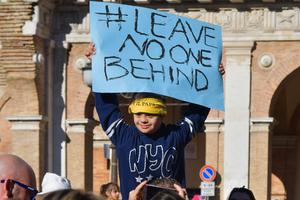 A boy with Down syndrome holds a placard while a crowd waits for the Pope’s arrival at the Shrine of Loreto, near Ancona, Italy, on March 25, 2019. A boy with Down syndrome holds a placard while a crowd waits for the Pope’s arrival at the Shrine of Loreto, near Ancona, Italy, on March 25, 2019.