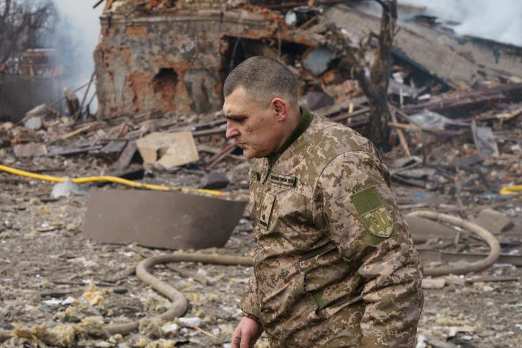 Ukraine army public affairs officer Valentin Yermolenko walks in front of a destroyed shoe factory following an airstrike in Dnipro on March 11, 2022. - Civilian targets came under Russian shelling in the central Ukrainian city of Dnipro on March 11, killing one, emergency services said, in what appeared to be the first direct attack on the city. Ukraine army public affairs officer Valentin Yermolenko walks in front of a destroyed shoe factory following an airstrike in Dnipro on March 11, 2022. - Civilian targets came under Russian shelling in the central Ukrainian city of Dnipro on March 11, killing one, emergency services said, in what appeared to be the first direct attack on the city.