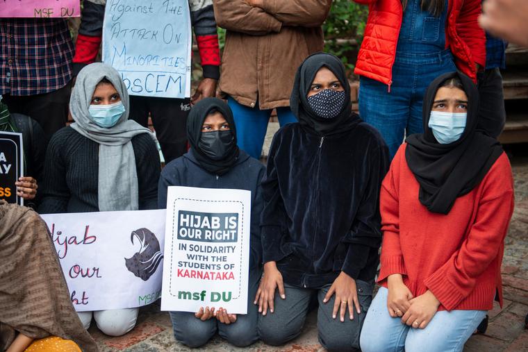 Muslim Student Federation (MSF) member holds a placard as she participates in a protest against the recent hijab ban in some high schools and colleges of Karnataka. Muslim Student Federation (MSF) member holds a placard as she participates in a protest against the recent hijab ban in some high schools and colleges of Karnataka.