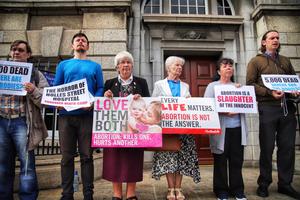 Members of the group ‘Our Lady of Lourdes Protectors’ hold a prayer vigil outside the national maternity hospital in Dublin, Ireland on July 13, 2019. Members of the group ‘Our Lady of Lourdes Protectors’ hold a prayer vigil outside the national maternity hospital in Dublin, Ireland on July 13, 2019.