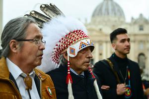 Newly-elected Dene Nation National Chief Gerald Antoine (l) and former national chief of Canada's Assembly of First Nations (AFN), Phil Fontaine (c), escorted by delegation members, arrive to address the media Thursday in St. Peter's Square following a meeting with the Pope. Newly-elected Dene Nation National Chief Gerald Antoine (l) and former national chief of Canada's Assembly of First Nations (AFN), Phil Fontaine (c), escorted by delegation members, arrive to address the media Thursday in St. Peter's Square following a meeting with the Pope.