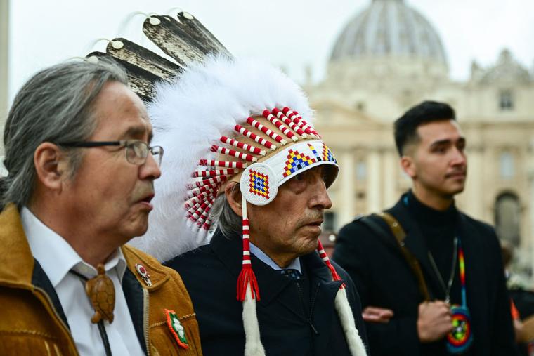 Newly-elected Dene Nation National Chief Gerald Antoine (l) and former national chief of Canada's Assembly of First Nations (AFN), Phil Fontaine (c), escorted by delegation members, arrive to address the media Thursday in St. Peter's Square following a meeting with the Pope. Newly-elected Dene Nation National Chief Gerald Antoine (l) and former national chief of Canada's Assembly of First Nations (AFN), Phil Fontaine (c), escorted by delegation members, arrive to address the media Thursday in St. Peter's Square following a meeting with the Pope.