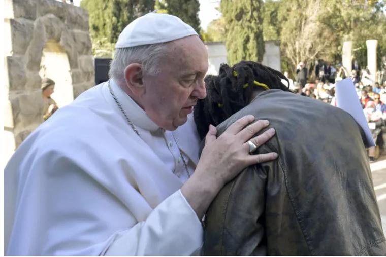 Pope Francis embraces Daniel Jude Oukeguale, who detailed his escape from Nigeria, during the Pope's visit to an immigration reception center in Hal Far, Malta, on April 3. Pope Francis embraces Daniel Jude Oukeguale, who detailed his escape from Nigeria, during the Pope's visit to an immigration reception center in Hal Far, Malta, on April 3.