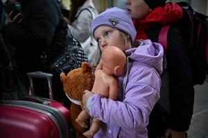 A young girl holds her doll as she passes through Przemysl train station after fleeing from war-torn Ukraine on Saturday in Przemysl, Poland. According to the United Nations, since Russia invaded Ukraine on Feb. 24 upward of 10 million people have been displaced and at least 1,100 civilians have been killed. A young girl holds her doll as she passes through Przemysl train station after fleeing from war-torn Ukraine on Saturday in Przemysl, Poland. According to the United Nations, since Russia invaded Ukraine on Feb. 24 upward of 10 million people have been displaced and at least 1,100 civilians have been killed.