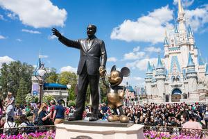 A Walt Disney statue stands in the Magic Kingdom theme park at Walt Disney World in Orlando, Florida A Walt Disney statue stands in the Magic Kingdom theme park at Walt Disney World in Orlando, Florida