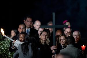 Women from Ukraine and Russia hold the cross at Rome’s Colosseum April 15 during the Vatican's Way of the Cross service. Women from Ukraine and Russia hold the cross at Rome’s Colosseum April 15 during the Vatican's Way of the Cross service.