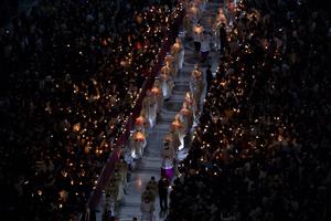 Candles flicker in St. Peter’s Basilica at the Vatican for the Easter vigil 2022 on April 16. Candles flicker in St. Peter’s Basilica at the Vatican for the Easter vigil 2022 on April 16.