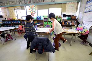 Students work on an assignment in class at Yung Wing School P.S. 124 on March 7 in New York City. Masks are optional for public-school children in New York as of March 7, though most students and teachers were still wearing them as of that date. Mask-wearing is among the recent sources of anxiety among children and teens. Students work on an assignment in class at Yung Wing School P.S. 124 on March 7 in New York City. Masks are optional for public-school children in New York as of March 7, though most students and teachers were still wearing them as of that date. Mask-wearing is among the recent sources of anxiety among children and teens.