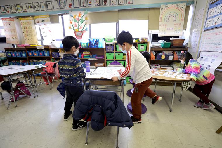 Students work on an assignment in class at Yung Wing School P.S. 124 on March 7 in New York City. Masks are optional for public-school children in New York as of March 7, though most students and teachers were still wearing them as of that date. Mask-wearing is among the recent sources of anxiety among children and teens. Students work on an assignment in class at Yung Wing School P.S. 124 on March 7 in New York City. Masks are optional for public-school children in New York as of March 7, though most students and teachers were still wearing them as of that date. Mask-wearing is among the recent sources of anxiety among children and teens.