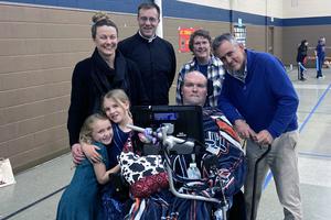 Garth Fritel is pictured with his wife Adeline, his daughters Tovah and Daphne, Father Jeff Lewis, Marie Brischer (faith formation director at his parish) and Kevin Wells. Garth Fritel is pictured with his wife Adeline, his daughters Tovah and Daphne, Father Jeff Lewis, Marie Brischer (faith formation director at his parish) and Kevin Wells.