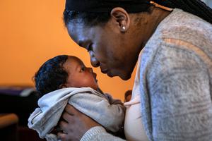 Geri Andre-Major holds her two-and-a-half-week-old son, Maverick, in Mount Vernon, New York. Catholics are calling for dioceses to bring their family-leave policies in accord with most secular companies, as well as Catholic social teaching. Geri Andre-Major holds her two-and-a-half-week-old son, Maverick, in Mount Vernon, New York. Catholics are calling for dioceses to bring their family-leave policies in accord with most secular companies, as well as Catholic social teaching.