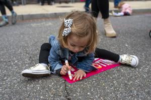 A girl colors on a sign as adults around her take part in a pro-abortion Mothers Day demonstration outside the U.S. Supreme Court on Sunday in Washington, DC. The building, currently surrounded by a temporary fence, has been the site of abortion-rights and anti-abortion activist demonstrations since the leaked draft of the Court’s potential decision to overturn Roe v. Wade nearly one week ago. A girl colors on a sign as adults around her take part in a pro-abortion Mothers Day demonstration outside the U.S. Supreme Court on Sunday in Washington, DC. The building, currently surrounded by a temporary fence, has been the site of abortion-rights and anti-abortion activist demonstrations since the leaked draft of the Court’s potential decision to overturn Roe v. Wade nearly one week ago.