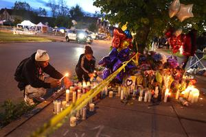 Mourners light candles at a makeshift memorial outside of a Tops grocery store on May 16 in Buffalo, New York. A gunman opened fire at the store May 14, killing 10 people and wounding another three. Police have said the attack was motivated by racial hatred. Mourners light candles at a makeshift memorial outside of a Tops grocery store on May 16 in Buffalo, New York. A gunman opened fire at the store May 14, killing 10 people and wounding another three. Police have said the attack was motivated by racial hatred.