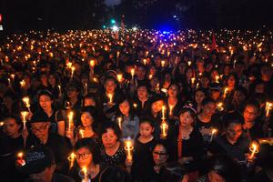 Protesters hold up a lighted candles to show solidarity in Bandung, Indonesia, on May 13, 2017, for the release of Jakarta’s governor Basuki Tjahaja Purnama, better known as “Ahok.” Ahok was jailed for two years after being found guilty of blasphemy, in a decision that stoked concerns over religious intolerance in the world’s most populous Muslim-majority nation. Protesters hold up a lighted candles to show solidarity in Bandung, Indonesia, on May 13, 2017, for the release of Jakarta’s governor Basuki Tjahaja Purnama, better known as “Ahok.” Ahok was jailed for two years after being found guilty of blasphemy, in a decision that stoked concerns over religious intolerance in the world’s most populous Muslim-majority nation.