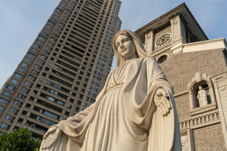 Marian statue in front of a Catholic church in Chongqing, China. Marian statue in front of a Catholic church in Chongqing, China.