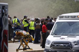 Emergency personnel gather near Robb Elementary School following a deadly shooting that killed at least 19 students on May 24 in Uvalde, Texas. Emergency personnel gather near Robb Elementary School following a deadly shooting that killed at least 19 students on May 24 in Uvalde, Texas.
