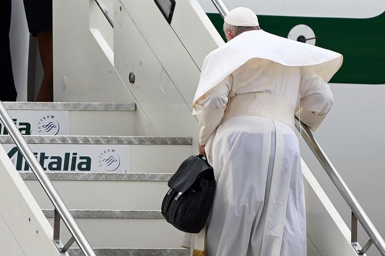 Pope Francis boards a plane of the new Italian airline company ITA Airways on Dec. 2, 2021, at Rome's Fiumicino airport, setting off for a visit to Cyprus and Greece. Pope Francis boards a plane of the new Italian airline company ITA Airways on Dec. 2, 2021, at Rome's Fiumicino airport, setting off for a visit to Cyprus and Greece.