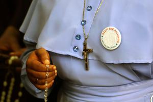 A religious sister prays the Rosary during a prayer and penance service for peace and security in Nigeria in Abuja on March 1, 2020. The Catholic Bishops of Nigeria organized the procession amid ongoing killings and kidnappings of Christians by Boko Haram and other Islamist groups. A religious sister prays the Rosary during a prayer and penance service for peace and security in Nigeria in Abuja on March 1, 2020. The Catholic Bishops of Nigeria organized the procession amid ongoing killings and kidnappings of Christians by Boko Haram and other Islamist groups.