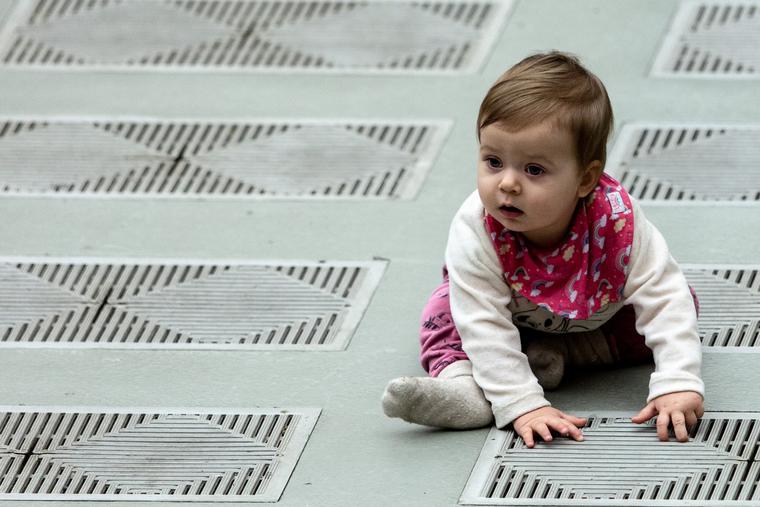 A baby sits on the floor at the Wednesday papal general audience inside the Paul VI Hall at the Vatican on Jan. 29, 2020. A baby sits on the floor at the Wednesday papal general audience inside the Paul VI Hall at the Vatican on Jan. 29, 2020.