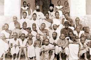 St. Charles Lwanga (top center, in front of the two European missionaries) and his companions, 19 of whom would be martyred with him eight months later, pose for a group photo in October 1885. St. Charles Lwanga (top center, in front of the two European missionaries) and his companions, 19 of whom would be martyred with him eight months later, pose for a group photo in October 1885.