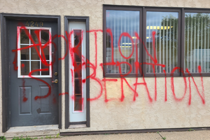 'Abortion Is Liberation' written in red spray paint outside the offices of Minnesota Concerned Citizens for Life. The attack was discovered the morning of Wednesday, June 15, 2022. 'Abortion Is Liberation' written in red spray paint outside the offices of Minnesota Concerned Citizens for Life. The attack was discovered the morning of Wednesday, June 15, 2022.