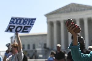 Pro-lifers march in front of the Supreme Court building on June 13 in Washington. Pro-lifers march in front of the Supreme Court building on June 13 in Washington.