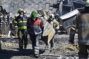 Workers on are seen clearing the rubble of the Amstor mall on June 28, the day after it was hit by a Russian missile strike, according to Ukrainian authorities, in Kremenchuk, Ukraine. Workers on are seen clearing the rubble of the Amstor mall on June 28, the day after it was hit by a Russian missile strike, according to Ukrainian authorities, in Kremenchuk, Ukraine.