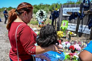 On June 29, people visit a makeshift memorial at the spot where a tractor-trailer was discovered with migrants inside, outside San Antonio, Texas. The number of migrants who died after they were abandoned in the trailer rose to 53 on Wednesday, U.S. immigration authorities said. On June 29, people visit a makeshift memorial at the spot where a tractor-trailer was discovered with migrants inside, outside San Antonio, Texas. The number of migrants who died after they were abandoned in the trailer rose to 53 on Wednesday, U.S. immigration authorities said.