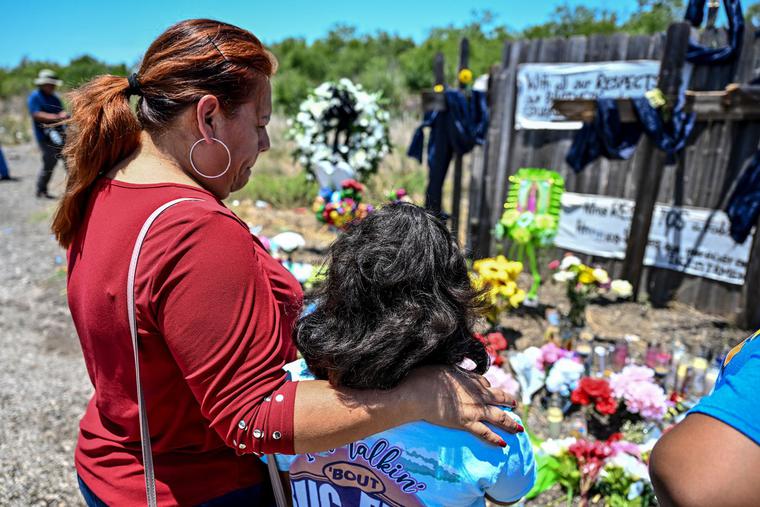 On June 29, people visit a makeshift memorial at the spot where a tractor-trailer was discovered with migrants inside, outside San Antonio, Texas. The number of migrants who died after they were abandoned in the trailer rose to 53 on Wednesday, U.S. immigration authorities said. On June 29, people visit a makeshift memorial at the spot where a tractor-trailer was discovered with migrants inside, outside San Antonio, Texas. The number of migrants who died after they were abandoned in the trailer rose to 53 on Wednesday, U.S. immigration authorities said.