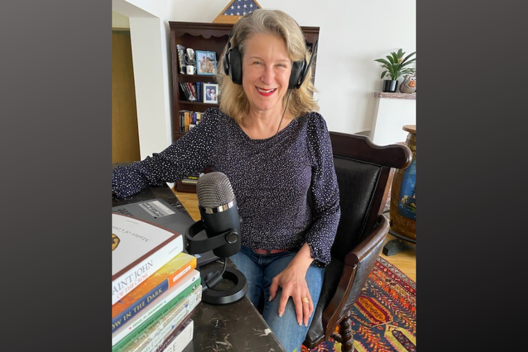 Lt. Michele McAloon at home in front of her microphone where she hosts her podcast. Lt. Michele McAloon at home in front of her microphone where she hosts her podcast.