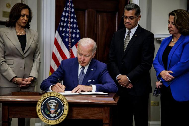 President Joe Biden, with (L-R) Vice President Kamala Harris, Health and Human Services Secretary Xavier Becerra and Deputy Attorney General Lisa Monaco, signs an executive order aimed at protecting abortion access in response to the Supreme Court’s decision to overturn Roe v. Wade, which legalized abortion throughout the U.S. President Joe Biden, with (L-R) Vice President Kamala Harris, Health and Human Services Secretary Xavier Becerra and Deputy Attorney General Lisa Monaco, signs an executive order aimed at protecting abortion access in response to the Supreme Court’s decision to overturn Roe v. Wade, which legalized abortion throughout the U.S.