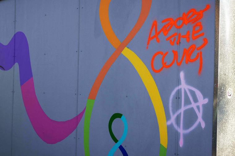 Spray-painted messages are seen at the Mother and Child Education Center in Portland, Oregon, on June 26 after the property was vandalized by demonstrators the night of June 25. Spray-painted messages are seen at the Mother and Child Education Center in Portland, Oregon, on June 26 after the property was vandalized by demonstrators the night of June 25.