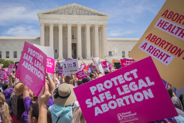 Pro-abortion protesters rally outside the Supreme Court. Pro-abortion protesters rally outside the Supreme Court.