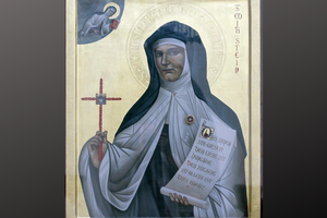 St. Teresa of Benedicta is shown on an icon in Bad Bergzabern, Germany. The scroll shows a quote from her works: ‘The innermost essence of love is self-offering. The entryway to all things is the Cross.’ St. Teresa of Benedicta is shown on an icon in Bad Bergzabern, Germany. The scroll shows a quote from her works: ‘The innermost essence of love is self-offering. The entryway to all things is the Cross.’