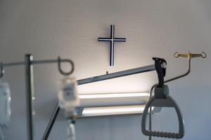 A hospital room in a Christian hospital with a cross hanging on the wall. A hospital room in a Christian hospital with a cross hanging on the wall.