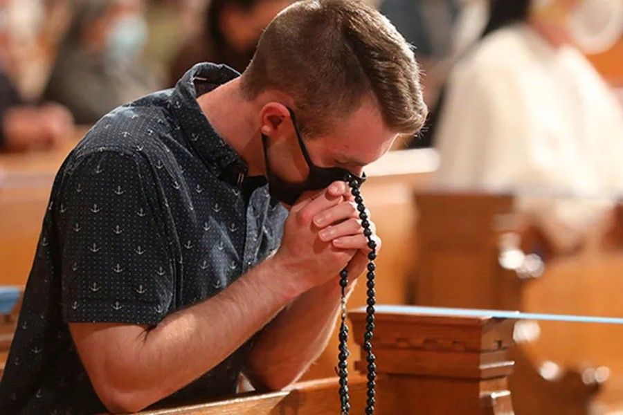 A man prays the Rosary in Chile amid the pandemic. A man prays the Rosary in Chile amid the pandemic.