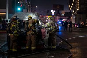 Firefighters work at the scene of a burnt collective transport vehicle after it was set on fire by unidentified individuals in Tijuana, Baja California state, Mexico, on August 12, 2022. Firefighters work at the scene of a burnt collective transport vehicle after it was set on fire by unidentified individuals in Tijuana, Baja California state, Mexico, on August 12, 2022.