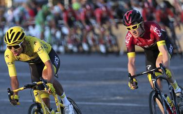 Colombia's Egan Bernal wearing the overall leader's yellow jersey, rides with Britain's Geraint Thomas on the Champs-Elysees during the twenty-first stage of the Tour de France cycling race over 128 kilometers (79.53miles) with start in Rambouillet and finish in Paris, France, Sunday, July 28, 2019. (AP Photo/Thibault Camus)
