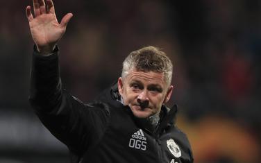 Manchester United's manager Ole Gunnar Solskjaer waves goodbye to fans after the group L Europa League soccer match between AZ Alkmaar and Manchester United at the ADO Den Haag stadium in The Hague, Netherlands, Thursday, Oct. 3, 2019. (AP Photo/Peter Dejong)
