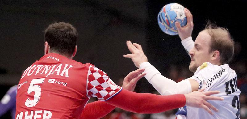 Domagoj Duvnjak u duelu sa Austrijancem Zajnerom